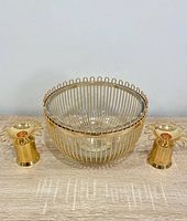 Bowl with glass insert flanked by two candle holders