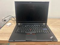 Front view of Lenovo ThinkPad T420 open showing screen and keyboard