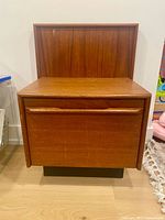 Front view of teak floating nightstand closed