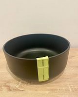 Angled view of planter showing overall shape, size and matte black finish