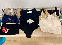 Overview of all undergarments laid out on surface