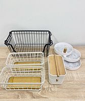 All five storage pieces grouped on tabletop