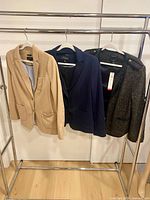 All three Talbots blazers on rack: tan, navy, tweed