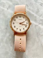 Front view of Timex Weekender watch showing dial, strap, and case