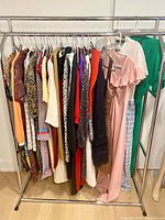 Clothing rack showing majority of dresses and skirts