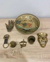 All seven brass items laid out