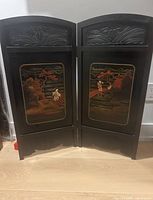 Full view of both hinged shutters standing upright