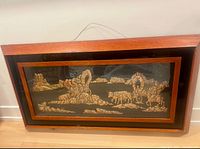 full view of framed copper relief artwork