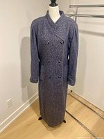 Front view of full-length Jocardi wool tweed coat on mannequin