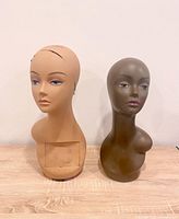 Front view of both mannequin torsos showing overall design and condition