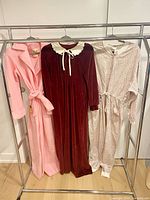 All three garments hanging on rack