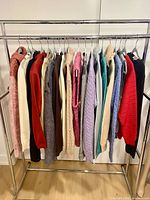 Rack showing all 19 assorted sweaters