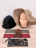 Group shot of both hats, two belts and pouch