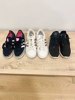 All three pairs side by side on wooden surface