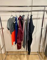 All six garments hanging on rack