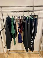 Full rack view of all 11 athletic wear pieces