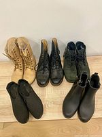 All five pairs arranged on wooden surface front and top view