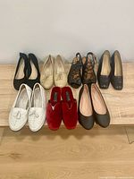 All seven shoe pairs displayed on bench