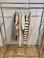 All six sweaters on rack
