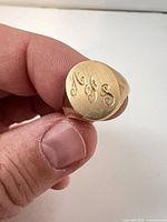 Front view showing monogrammed oval bezel "AFS"