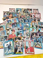Wide view of loose 1989 Topps baseball cards spread out on surface