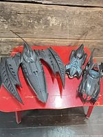 All three Batmobile vehicles on table for overall view