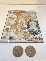 Full view of Thailand coin set with two loose U.S. dollar coins