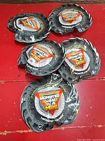 Five sealed Monster Jam Mini Series 5 packs laid out