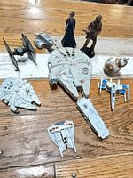 Group shot of all ten miniature Star Wars items on tabletop