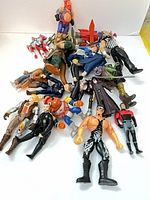 Group shot of all loose action figures spread on white background