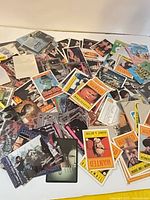 Overview of pile showing Dick Tracy "Wanted" cards, Terminator, TMNT, wrestling and baseball cards
