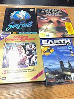 All four boxed PC games displayed
