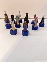 Group shot of all 11 blue-base Star Wars Pepsi bottle toppers