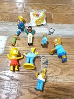 All nine Simpsons items laid out on floor