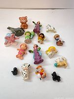 All 18 PVC figures arranged on white backdrop