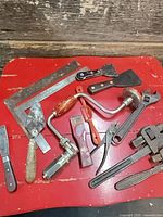 Full lot of mixed vintage hand tools on red background