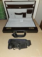 Open briefcase with shoulder strap displayed