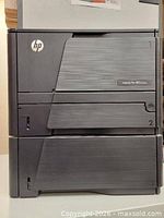 Front view showing HP LaserJet Pro 400 printer stacked on 500-sheet tray