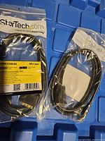 Two sealed StarTech HDMI-to-DVI-D cables in factory packaging