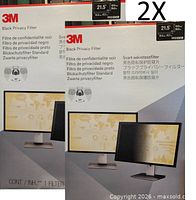 Front of two boxed 3M privacy filters showing model and size