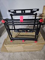 Overall view of Peerless DS-VW775 mount on top of cardboard box