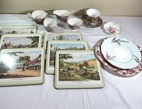 Full lot overview showing placemats, teacups, plates and saucers