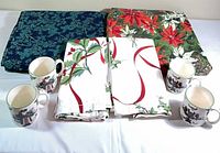 Lot overview showing two tablecloths, folded napkins, four Spode mugs