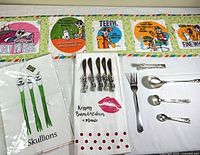 Overall view of quilted runner, two towels, spreader knives, fork and spoons