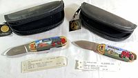 Two Franklin Mint knives with pouches and tags