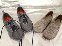 Both pairs of shoes side by side