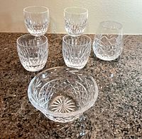 Group shot of three wine glasses, two old fashioned glasses and bowl