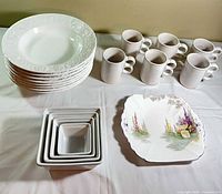 All items grouped: stacked Italian soup bowls, six mugs, nested square bowls, Shelley plate