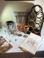 Full lot showing rack, cooler, tote, stemware, towels