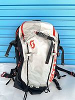 Front view white panel with red SCOTT logo and straps